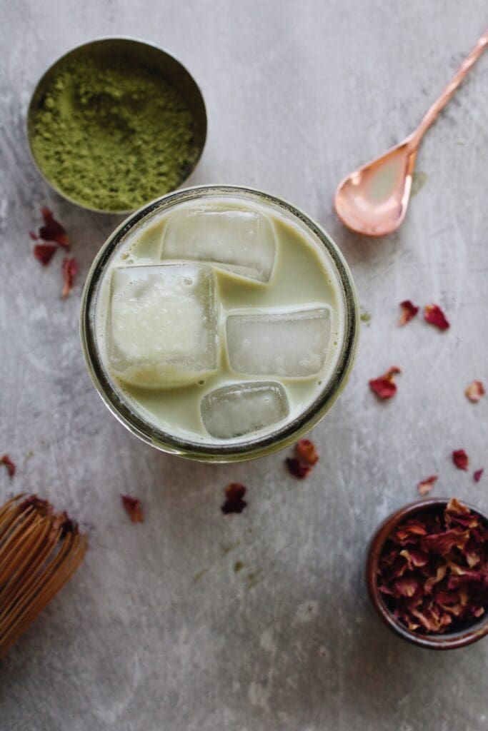 top down view of rose matcha latte in a mason jar