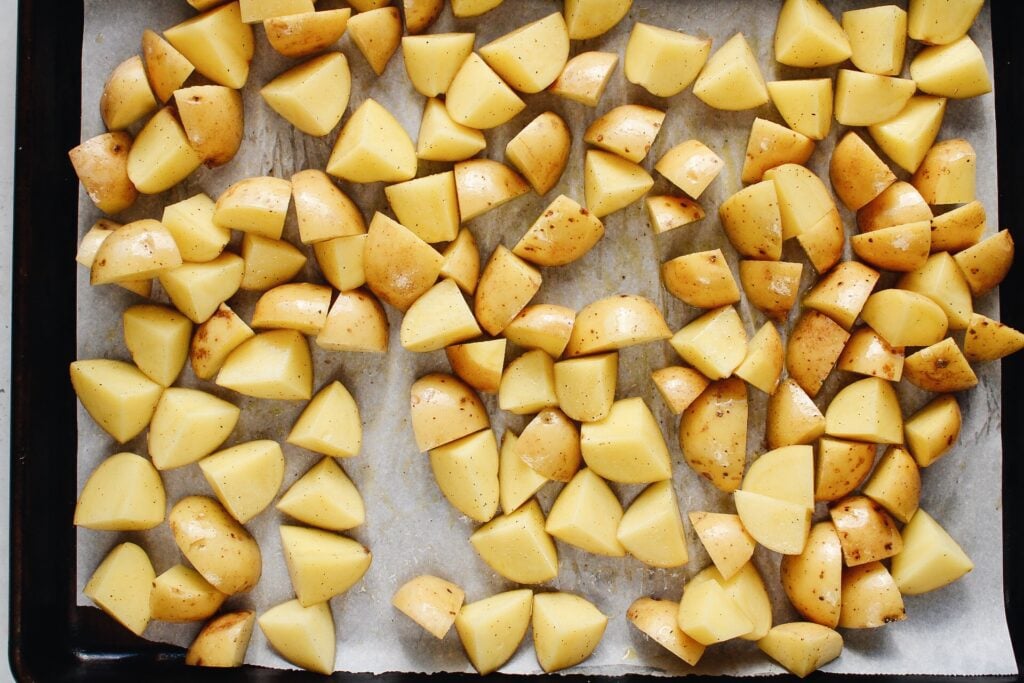 cut potatoes on baking sheet before cooking