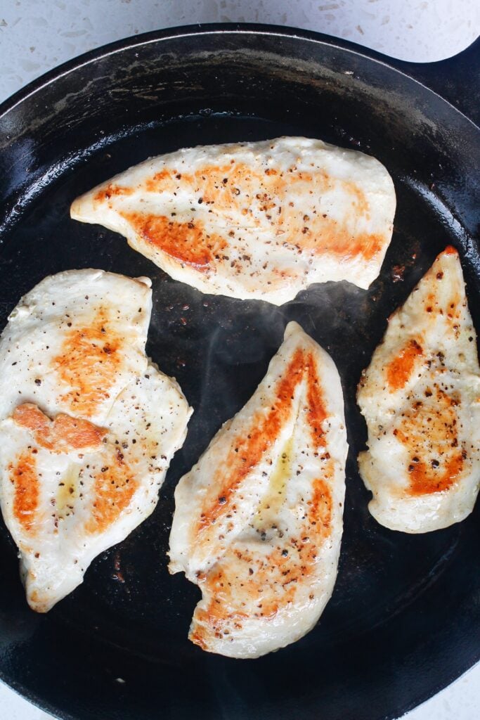 seared chicken breast in cast iron pan