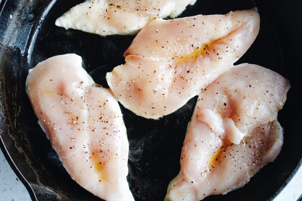 chicken breast in a cast iron skillet