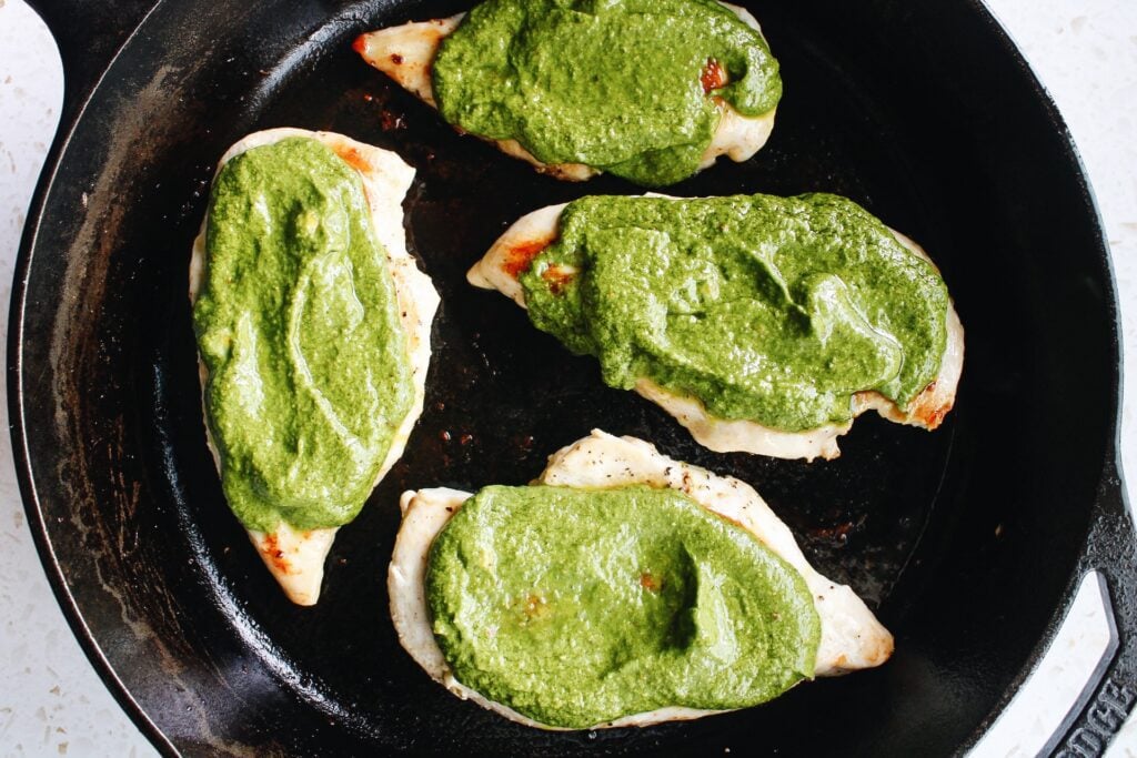 cooked chicken breast smothered with pesto