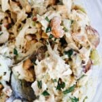 curry chicken salad with grapes in a glass bowl