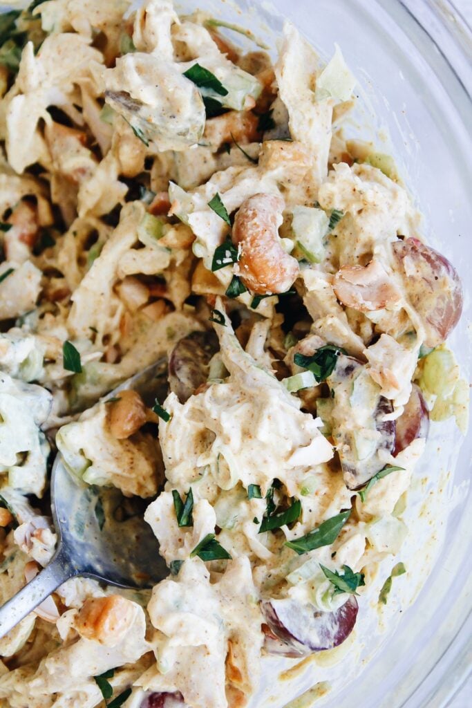 curry chicken salad with grapes in a glass bowl