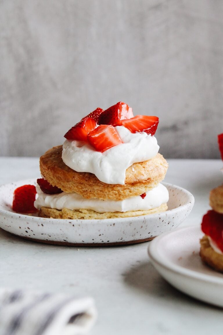 biscuit strawberry shortcake on a white dessert plate