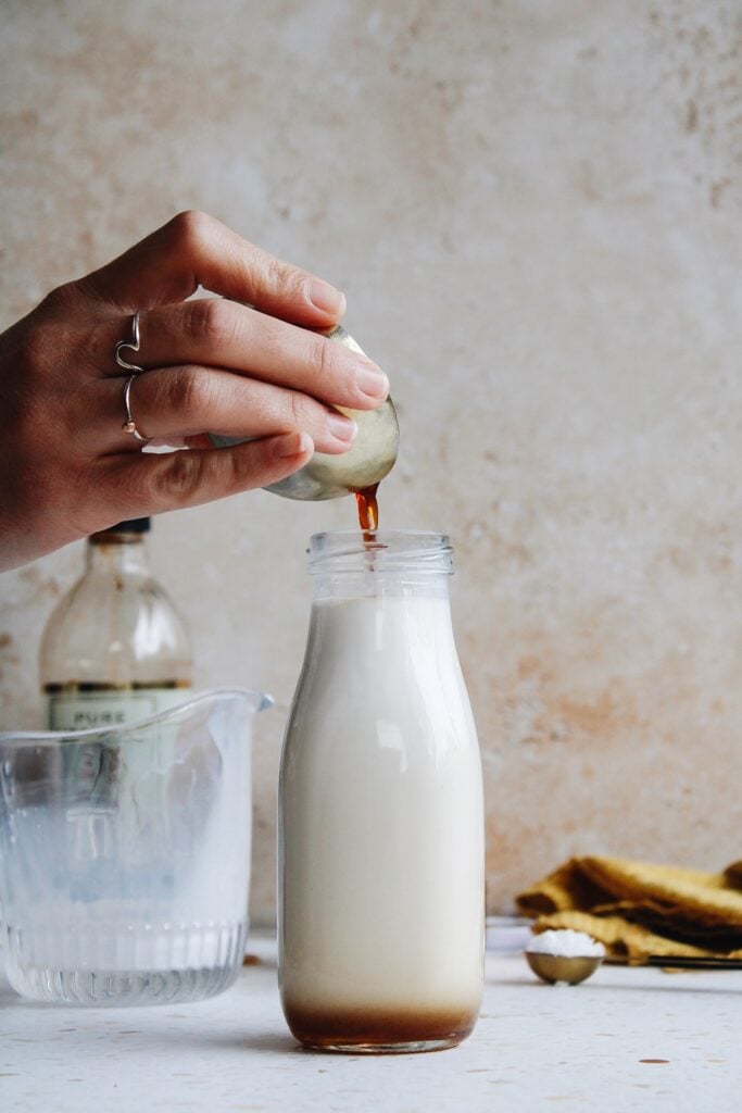 vanilla being poured into bottle