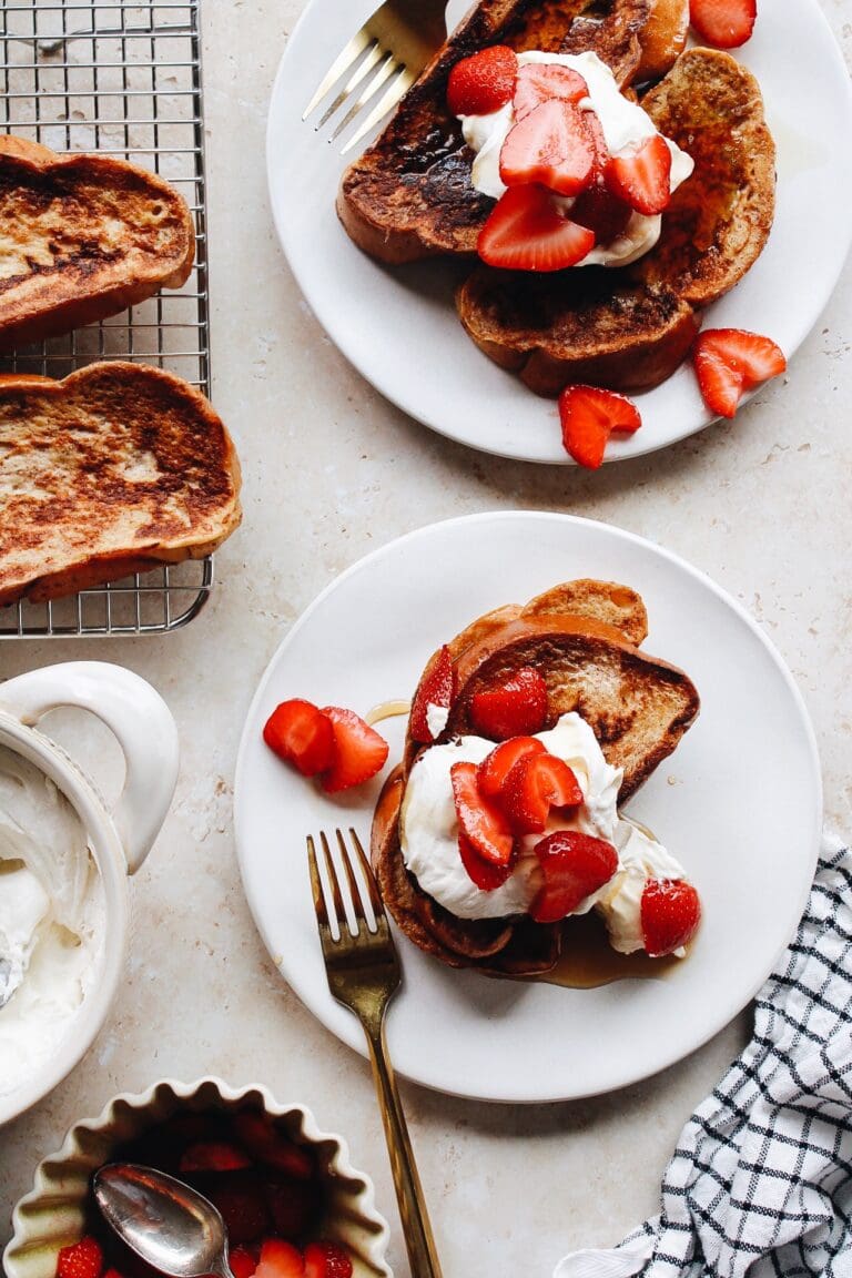 mascarpone french toast with berries on white plates