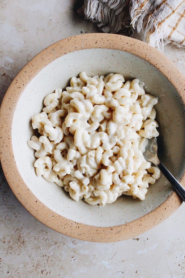 boursin mac and cheese in a bowl with a spoon