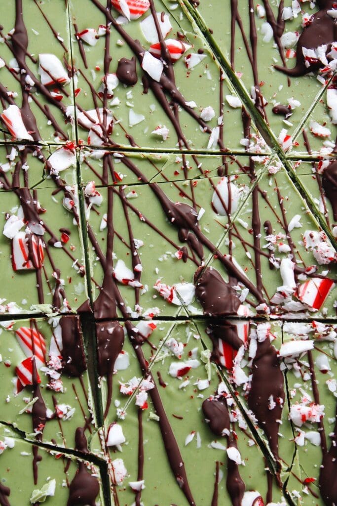 matcha peppermint bark drizzled with dark chocolate and crushed candy cane