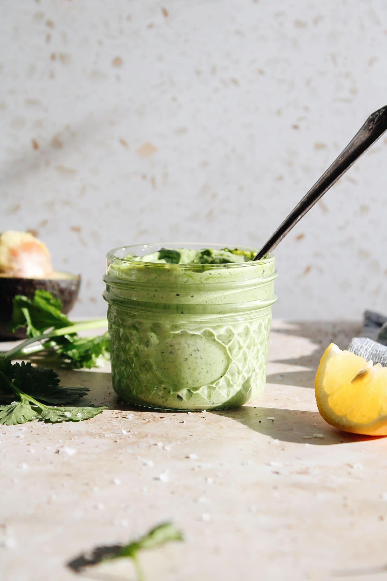 creamy cilantro sauce in a glass jar