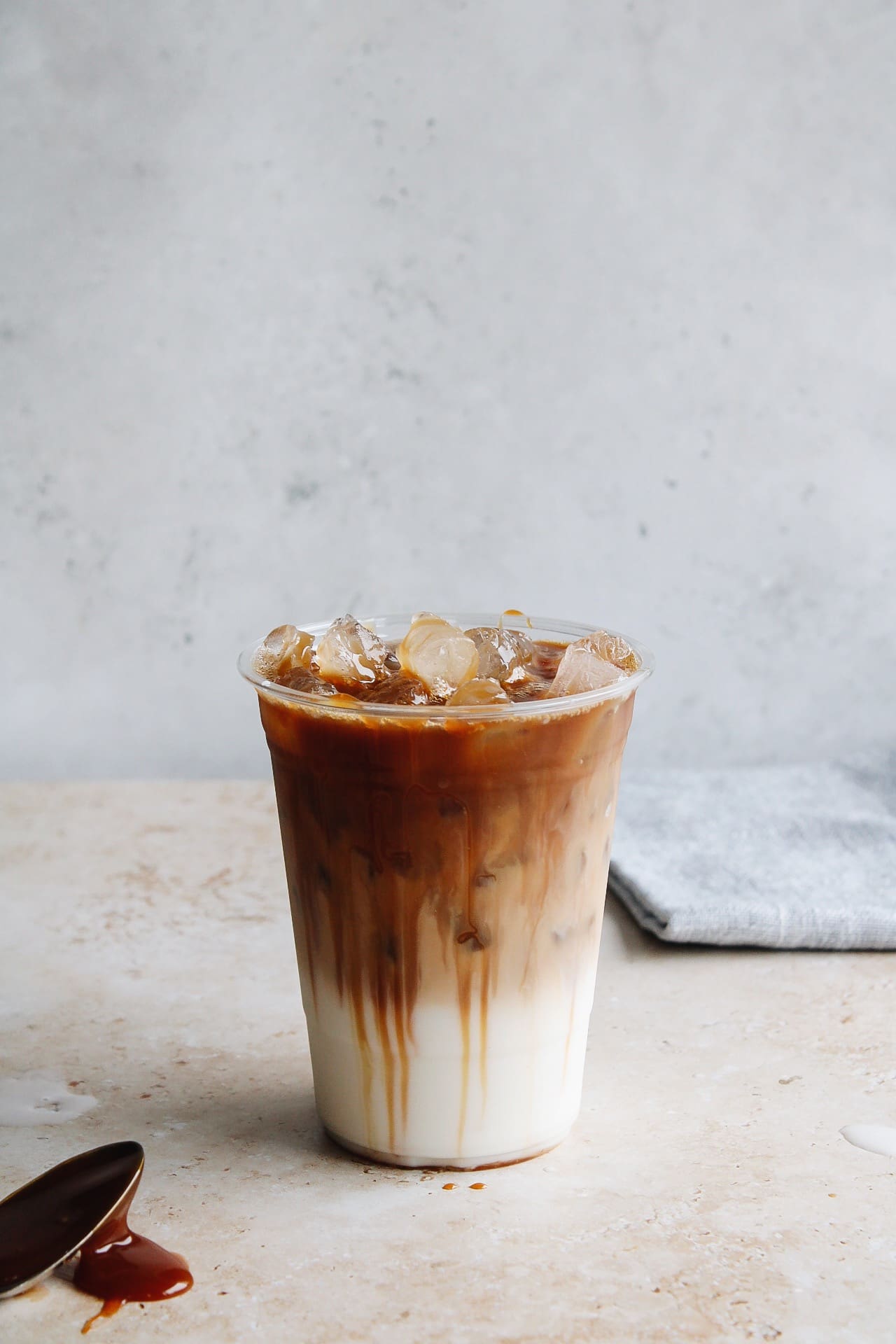 iced caramel macchiato in a plastic to go cup