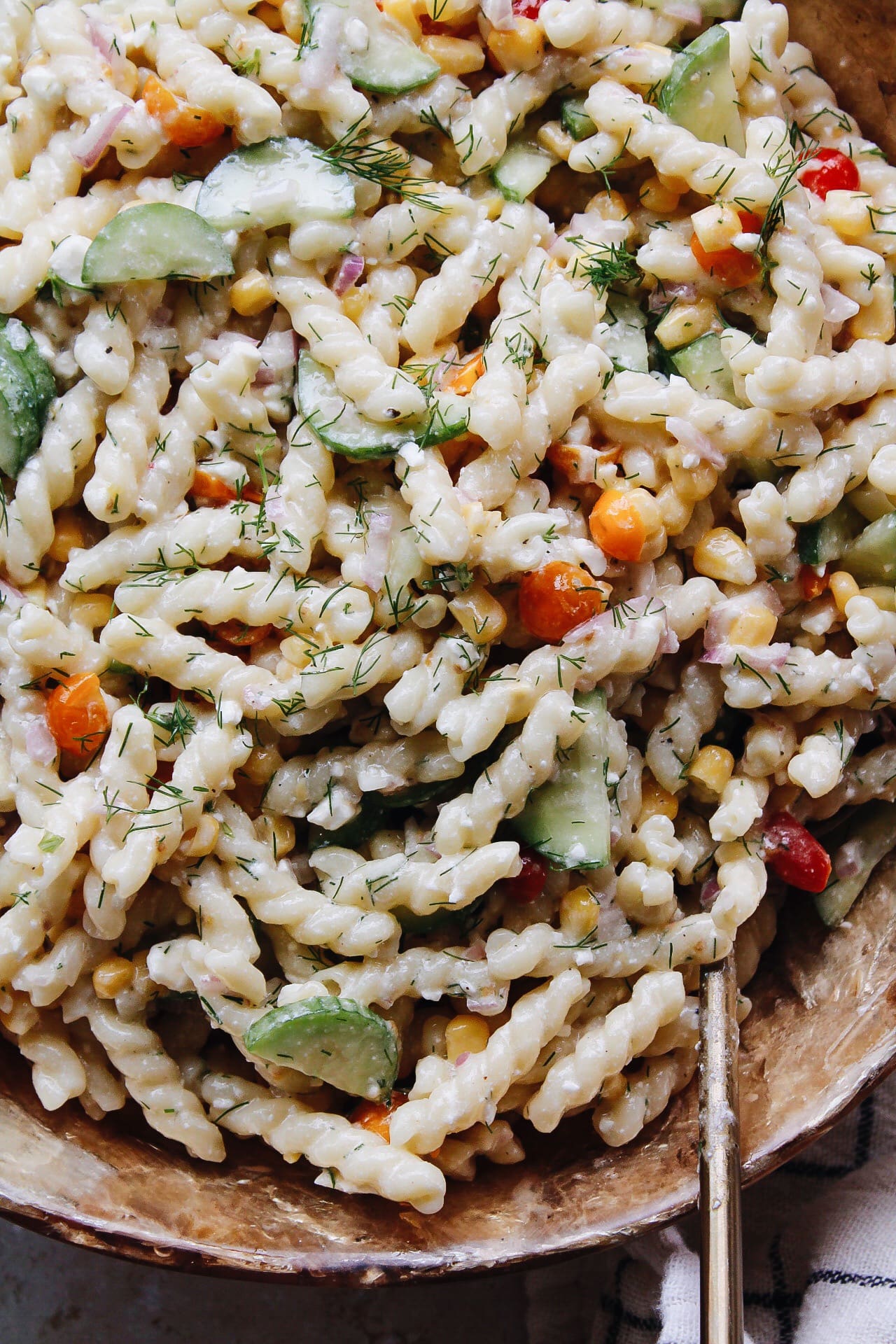 corn pasta salad with creamy dill dressing in a bowl